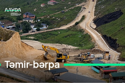 Qusarda selin dağıtdığı yolda bərpa işləri aparılır